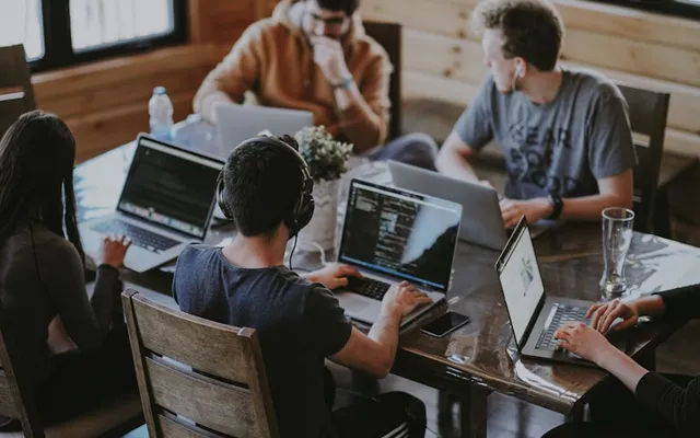 Team orchestrating delivery with AI assistance